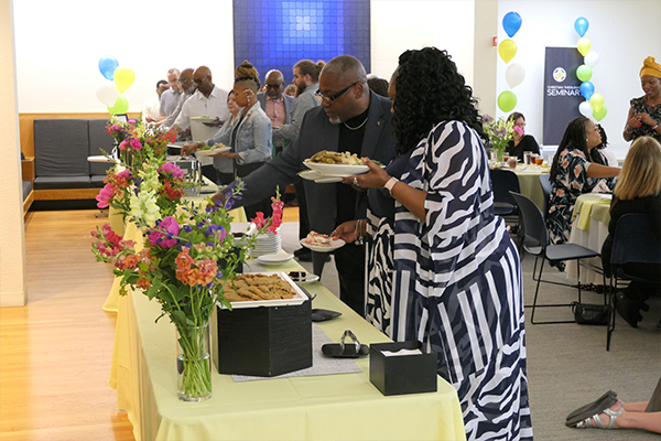 Students, Faculty, and Guests get food for fellowship time at the 2024 Commencement Celebration.