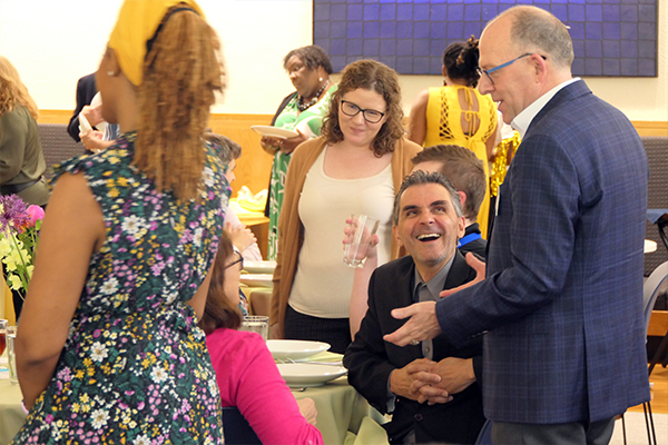 President Mellott, Dr. Matthias Beier, and Dr. Amy Lindeman Allen talk with student and families at the 2024 Commencement Celebration