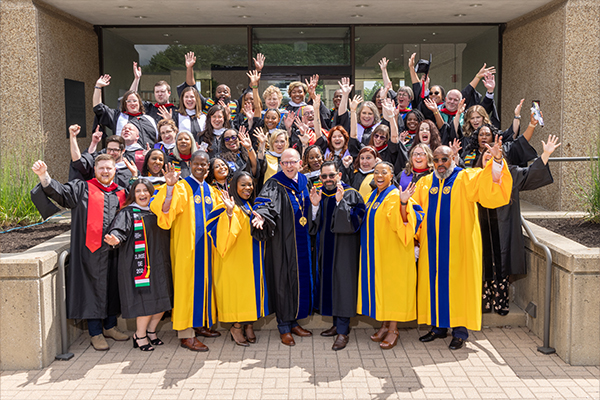 A group photo of the 2024 graduates and faculty members from Commencement